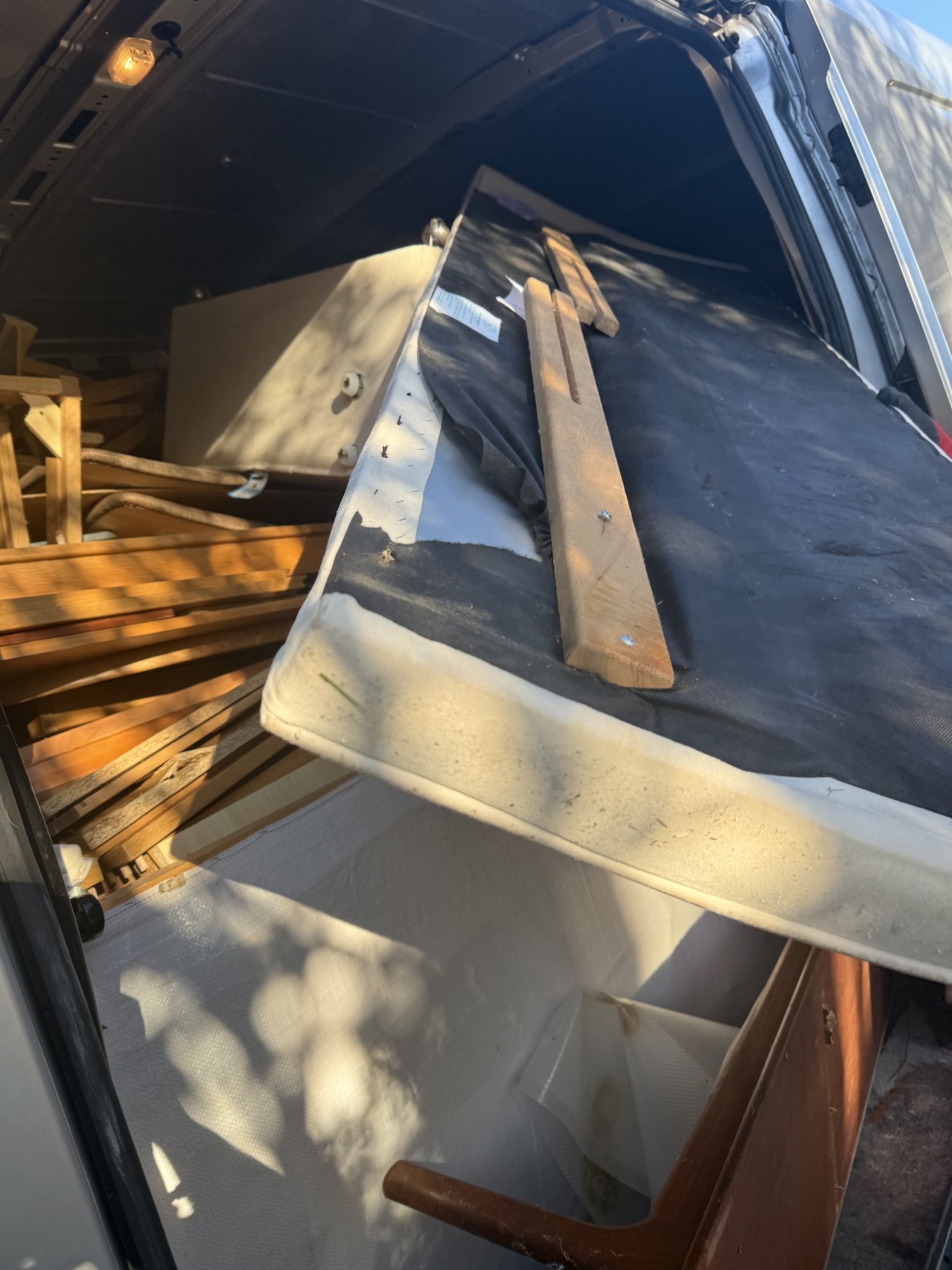 Furniture stacked and strapped inside the removals van
